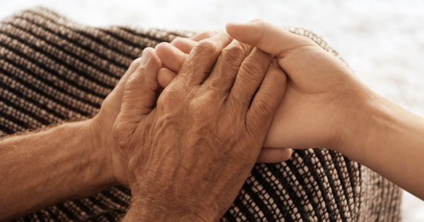 Elder holding a youth's hands
